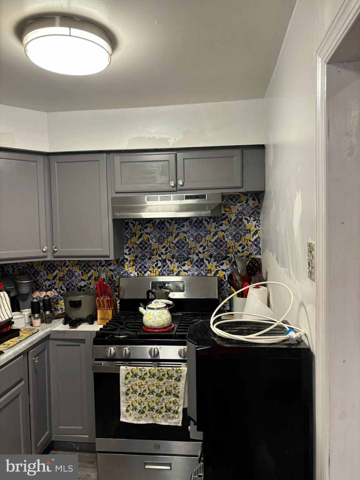 1513 Rainer Road Brookhaven, PA 19015 - Photo 9 of 21 a kitchen with a stove and a sink