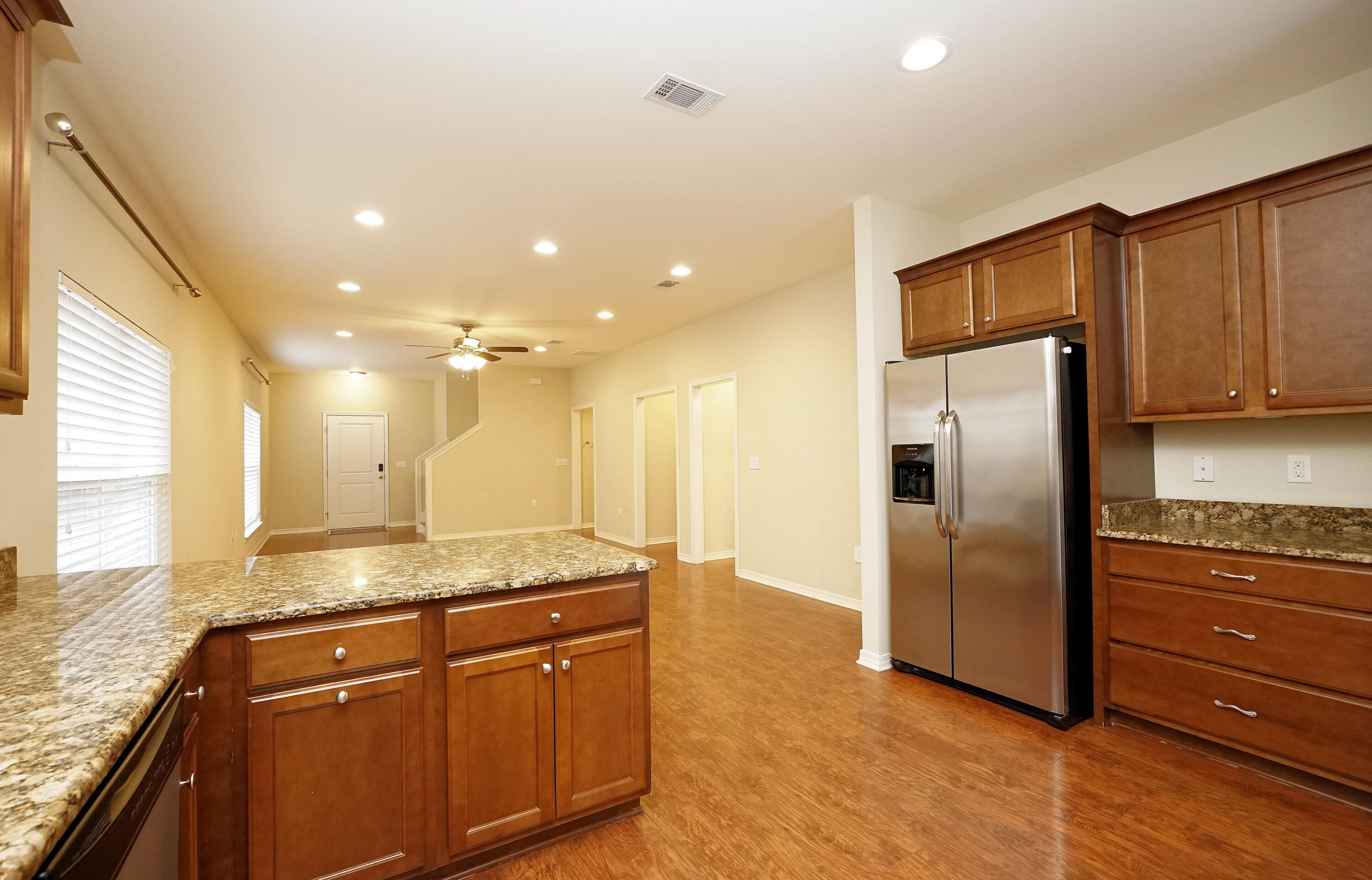 1305 Finck Road Niceville, FL 32578 - Photo 12 of 28 a kitchen with stainless steel appliances granite countertop a refrigerator a sink and a stove