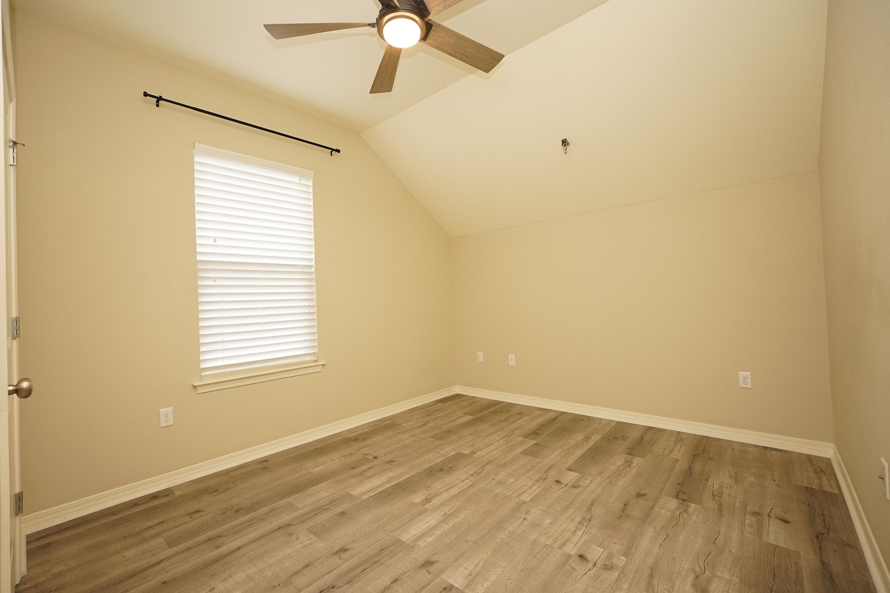 1305 Finck Road Niceville, FL 32578 - Photo 19 of 28 wooden floor in an empty room with a window