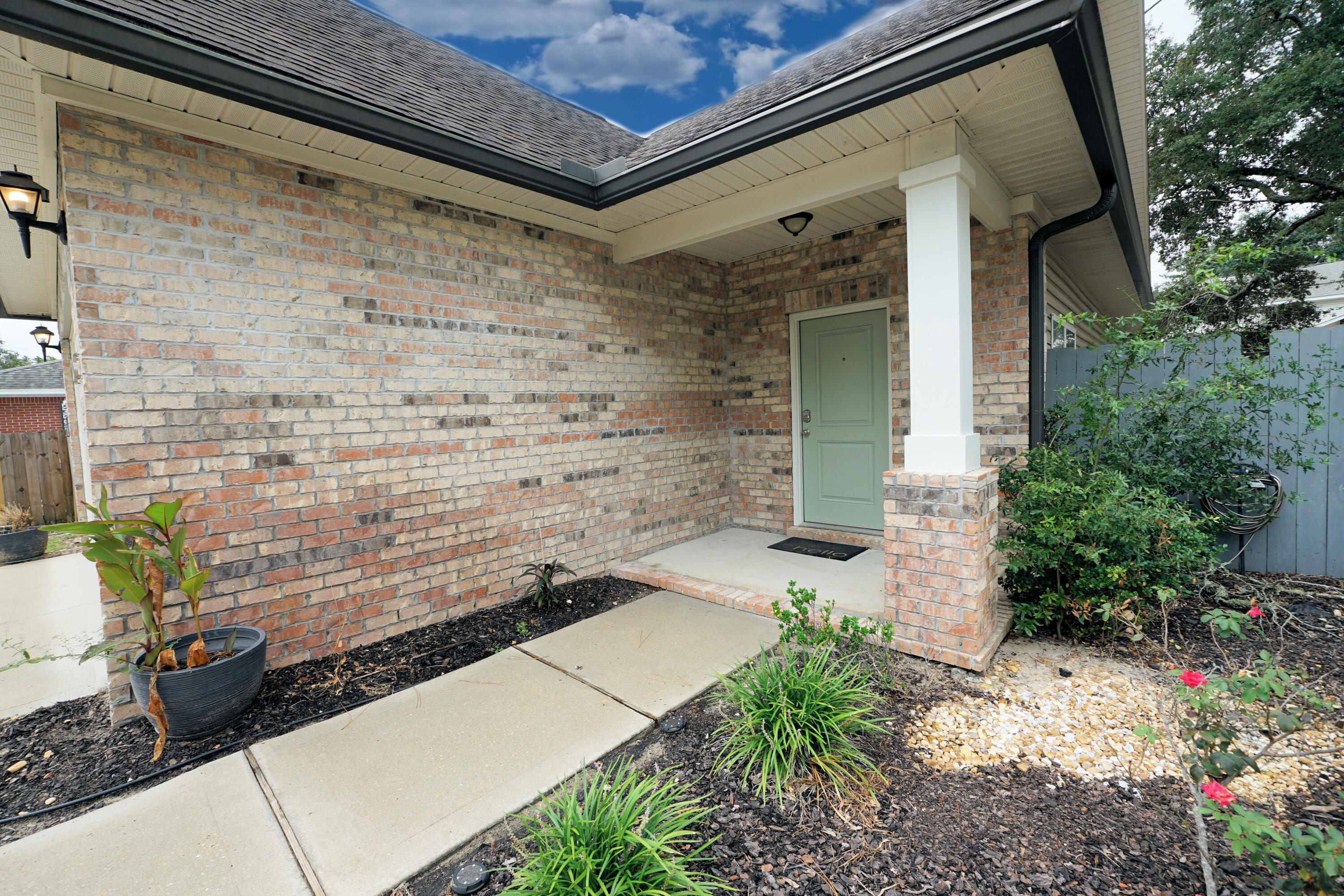 1305 Finck Road Niceville, FL 32578 - Photo 2 of 28 a front view of a house with a yard