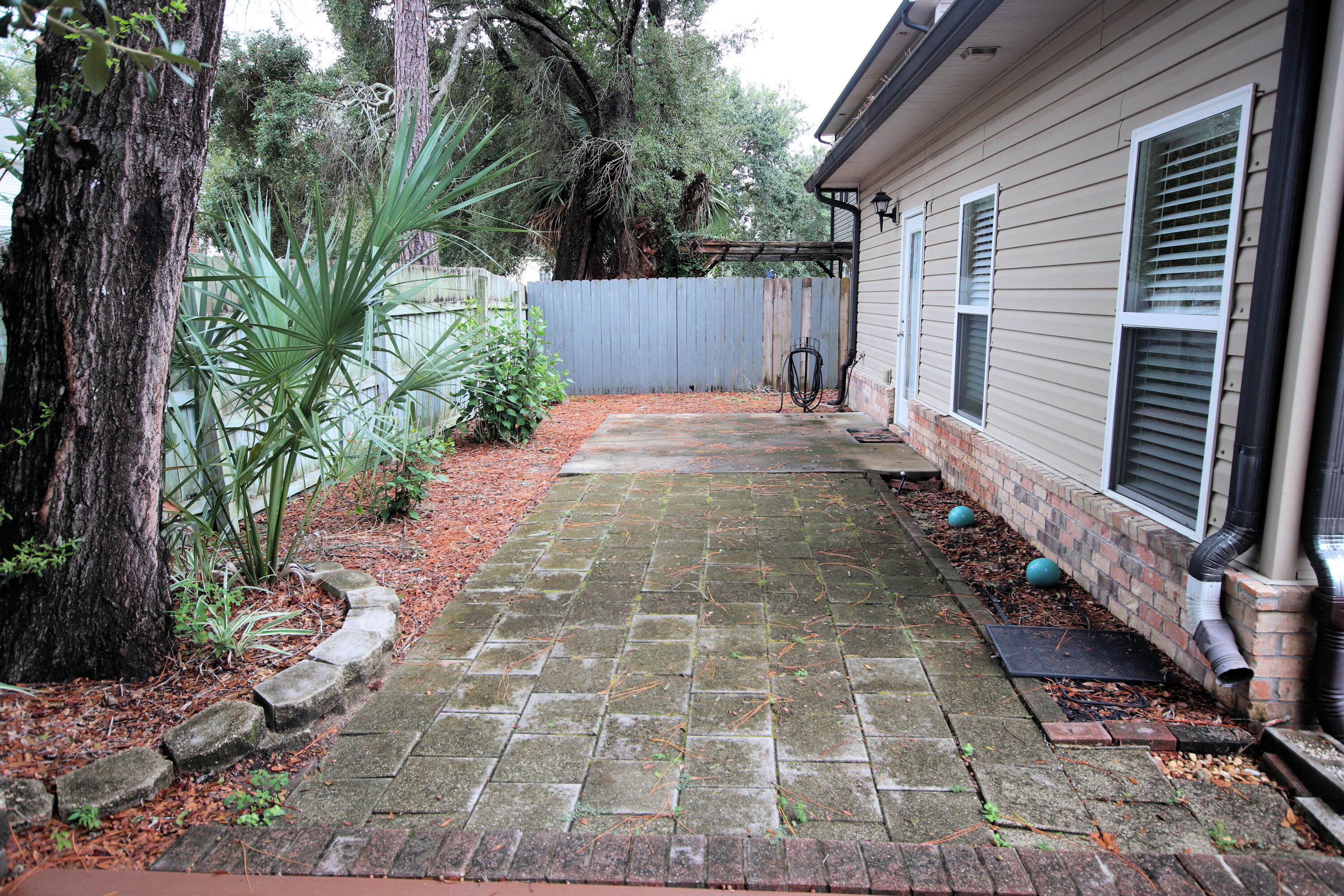 1305 Finck Road Niceville, FL 32578 - Photo 25 of 28 a view of a back yard with green space