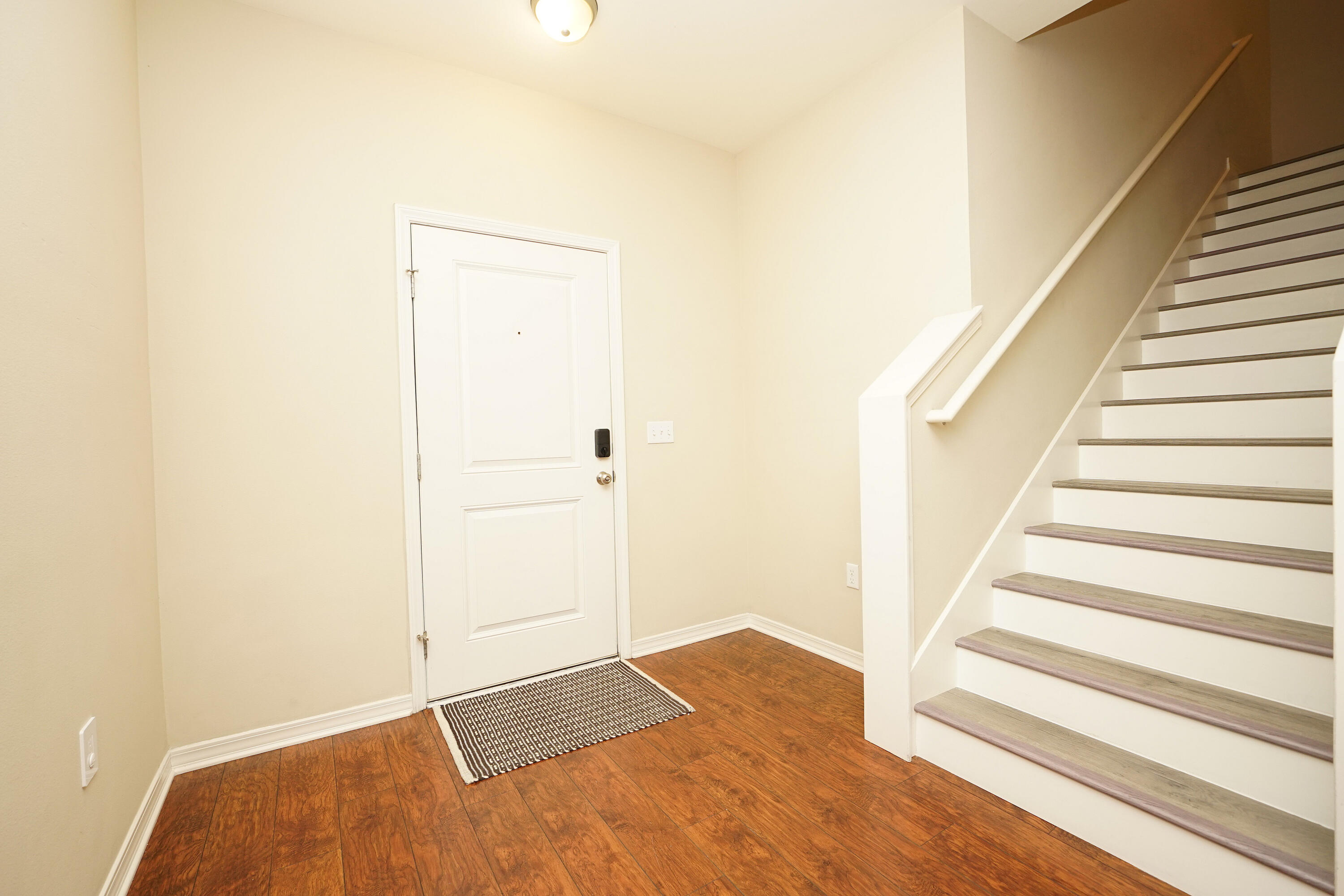 1305 Finck Road Niceville, FL 32578 - Photo 3 of 28 a view of an empty room with wooden floor and entryway