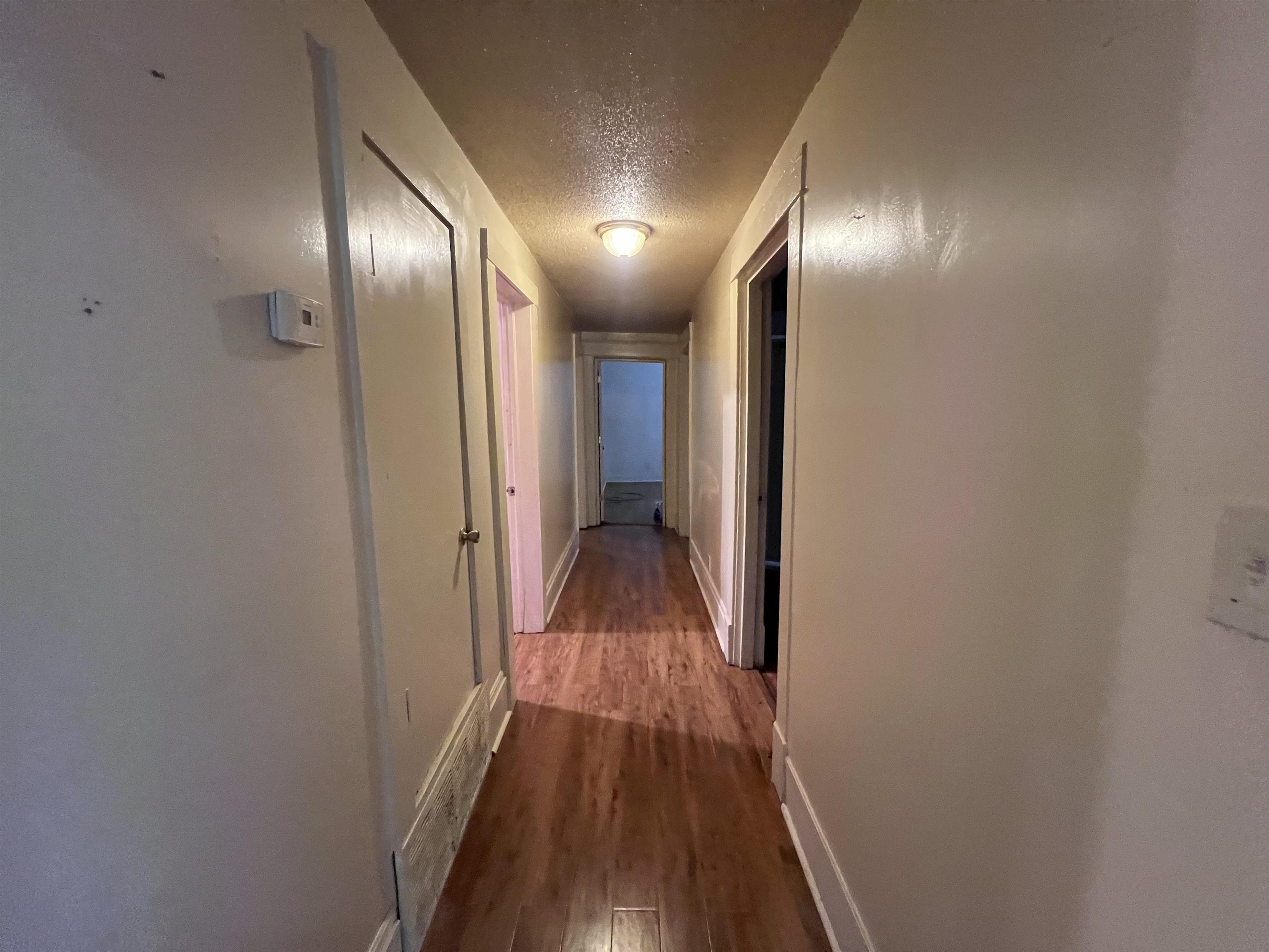 946 Roland Street Memphis, TN 38114 - Photo 11 of 32 a view of hallway with wooden floor