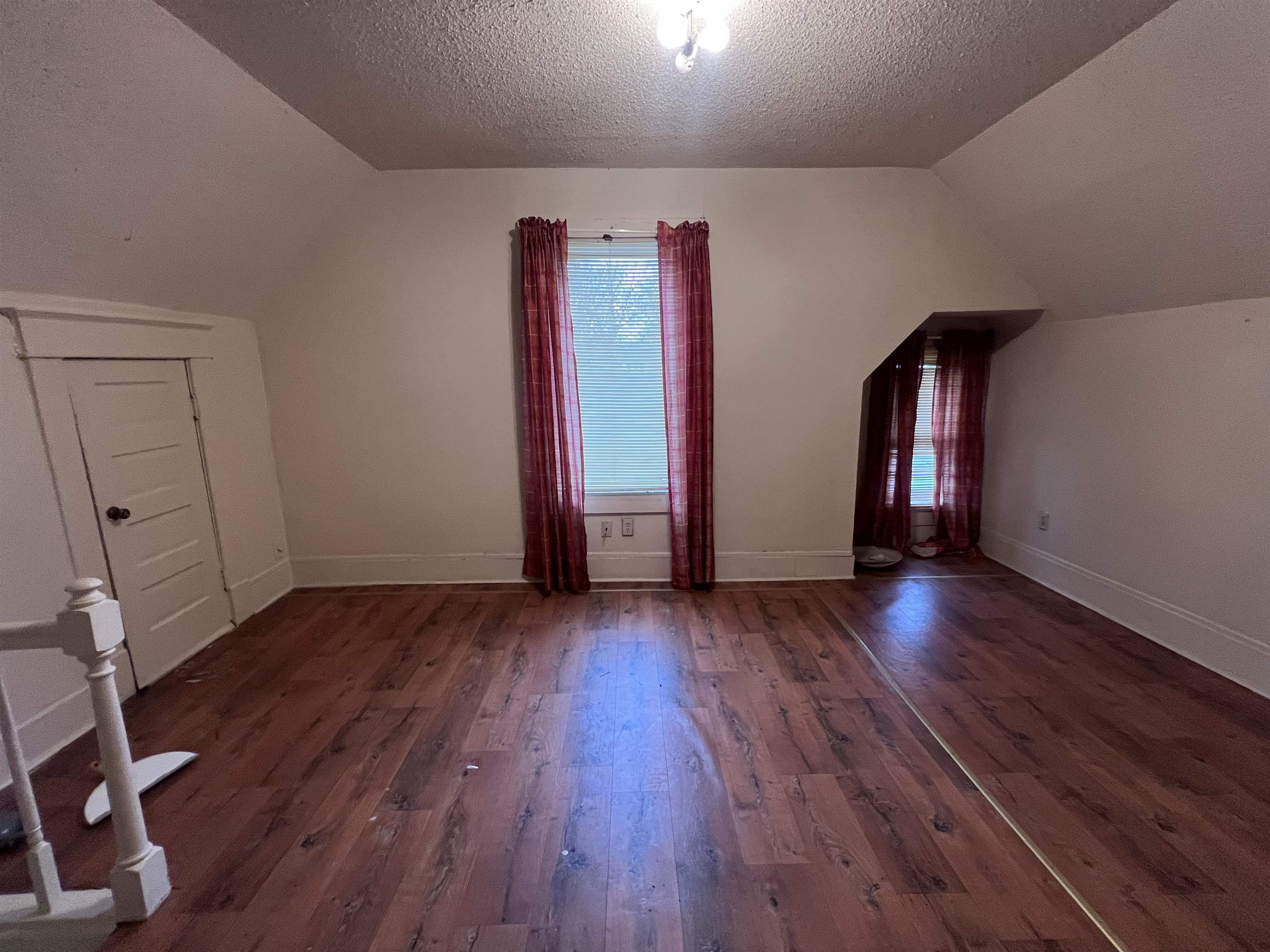 946 Roland Street Memphis, TN 38114 - Photo 19 of 32 a view of empty room with wooden floor and window