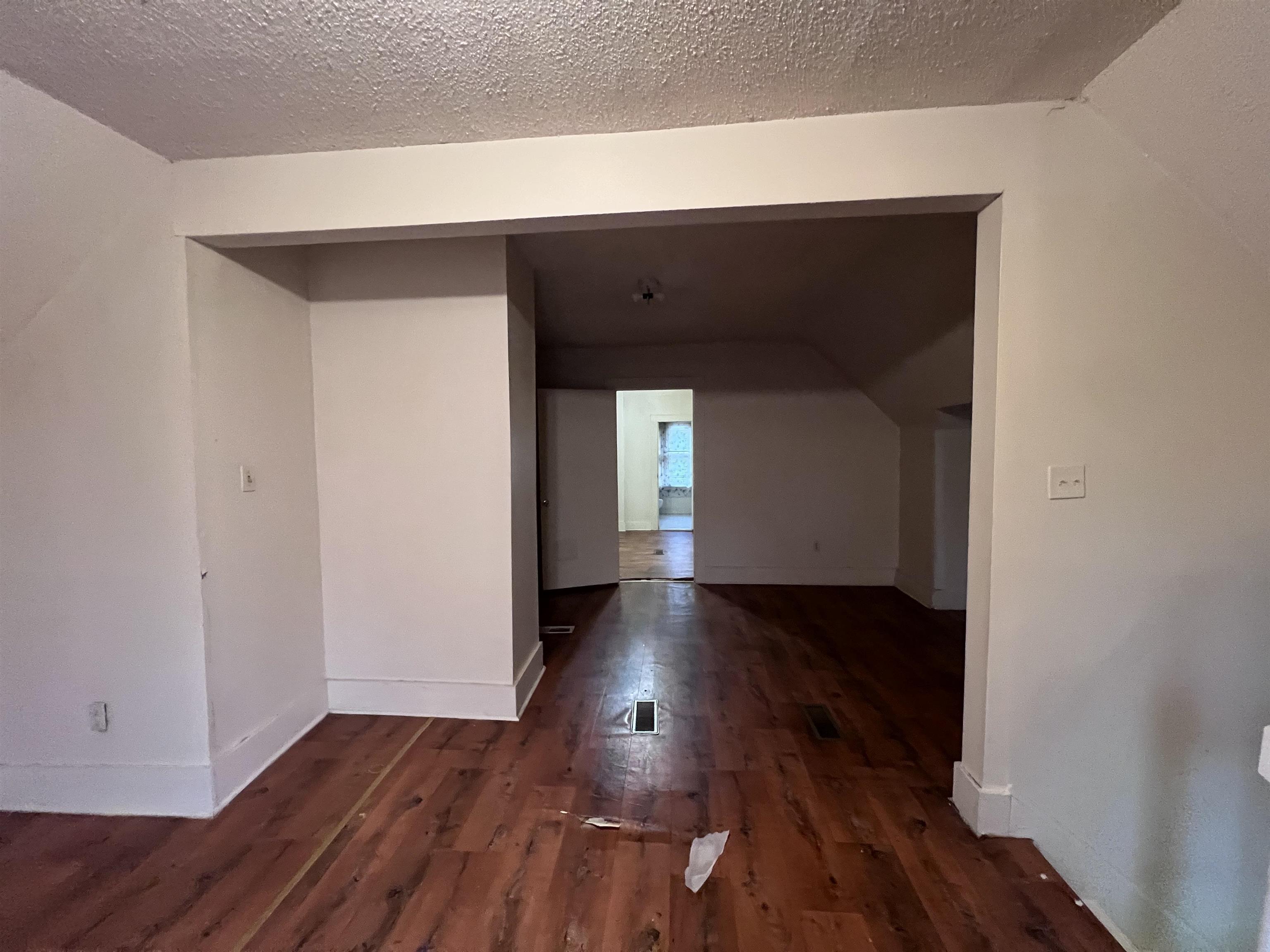 946 Roland Street Memphis, TN 38114 - Photo 20 of 32 a view of a hallway with wooden floor