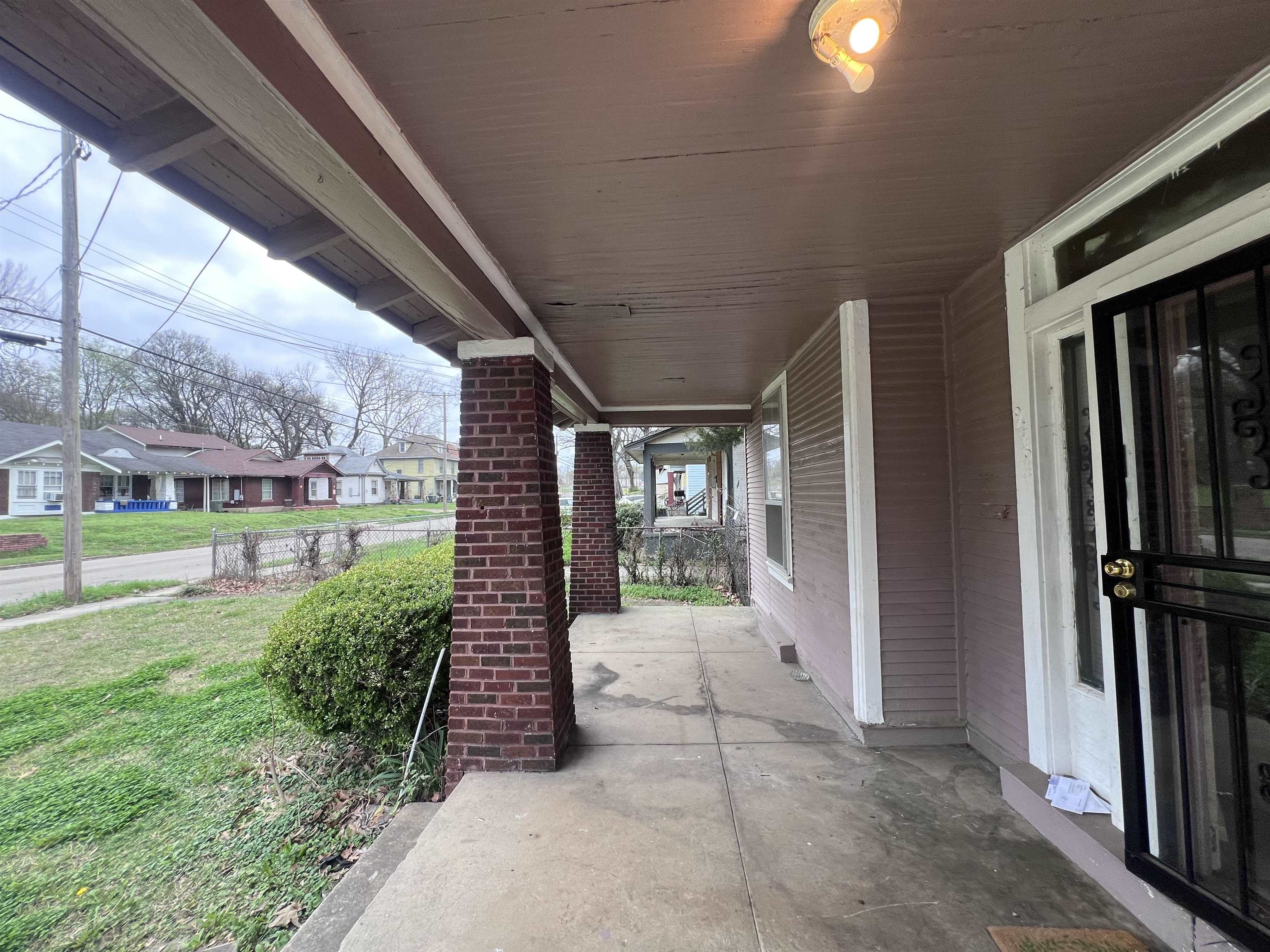 946 Roland Street Memphis, TN 38114 - Photo 2 of 32 a view of a porch with couches and floor to ceiling window