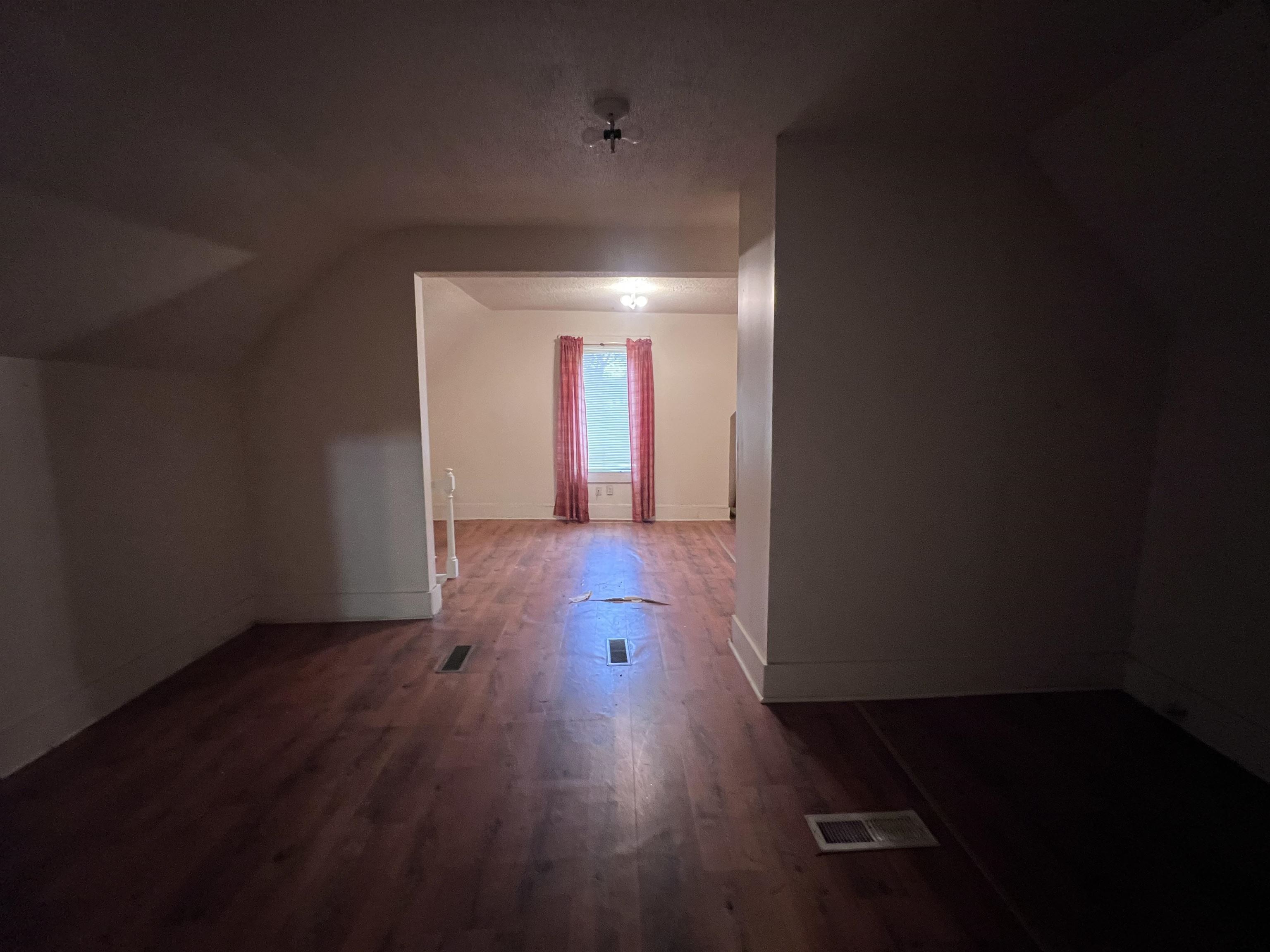 946 Roland Street Memphis, TN 38114 - Photo 23 of 32 wooden floor in an empty room with a window