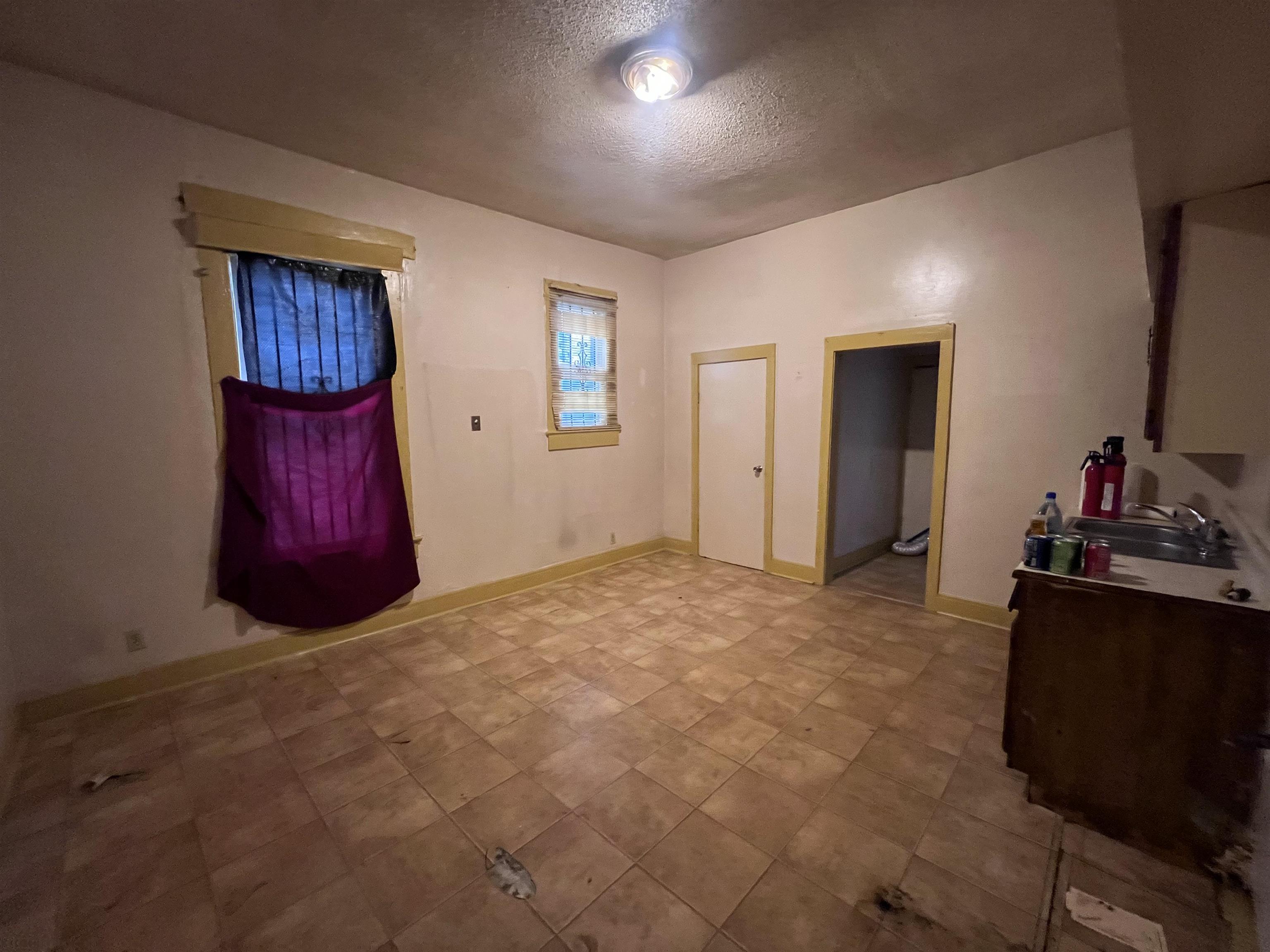 946 Roland Street Memphis, TN 38114 - Photo 25 of 32 a living room with furniture and a flat screen tv