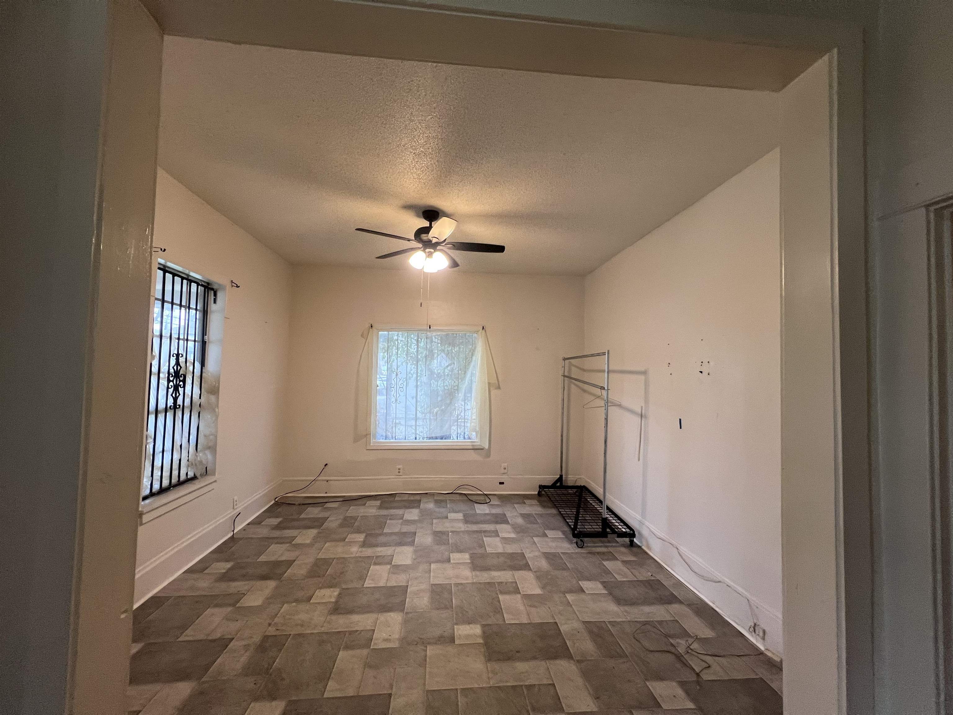 946 Roland Street Memphis, TN 38114 - Photo 6 of 32 a view of an empty room with a window