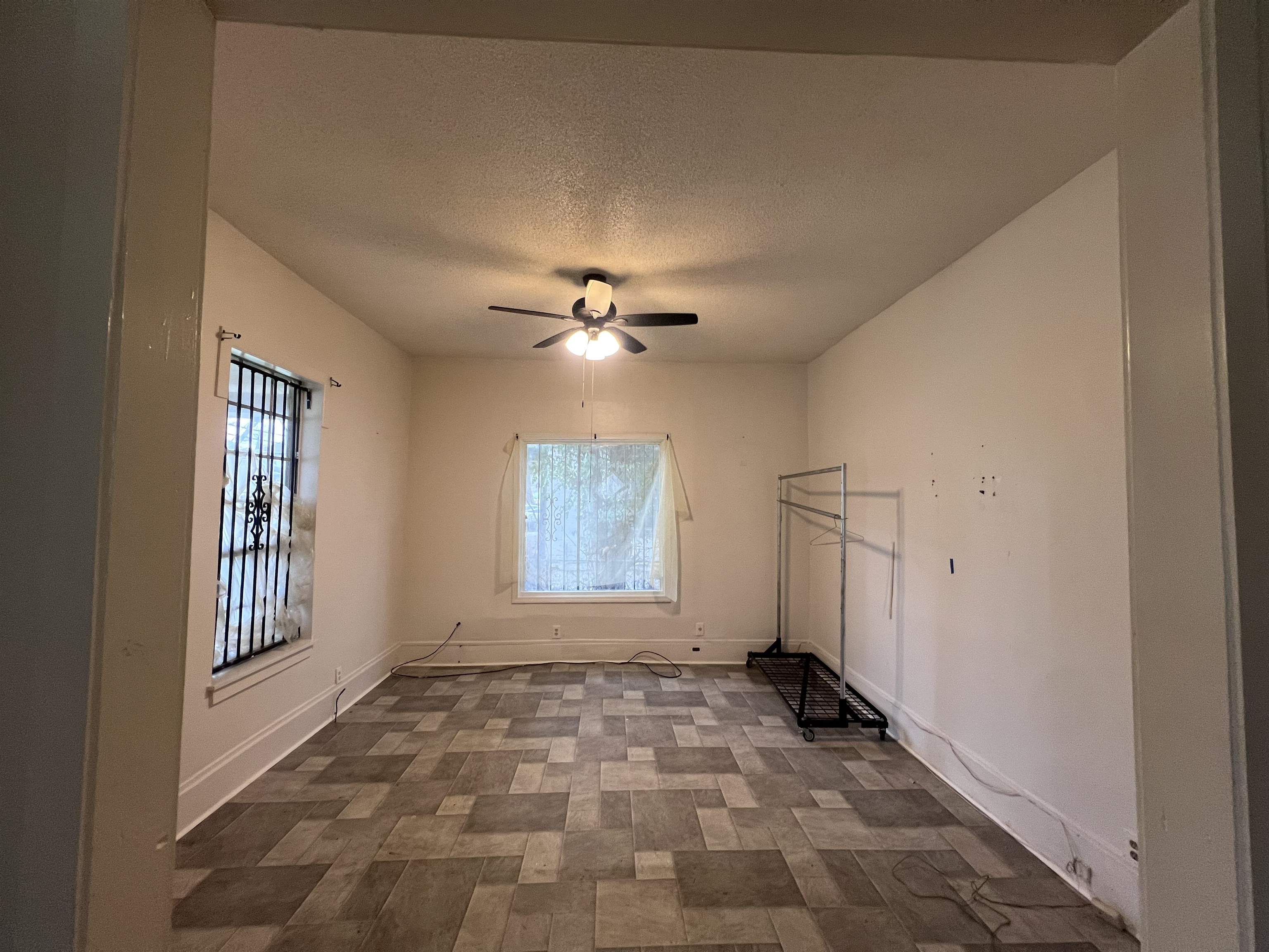 946 Roland Street Memphis, TN 38114 - Photo 9 of 32 a view of an empty room with a window