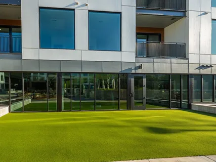 a outdoor living area with furniture and a rug