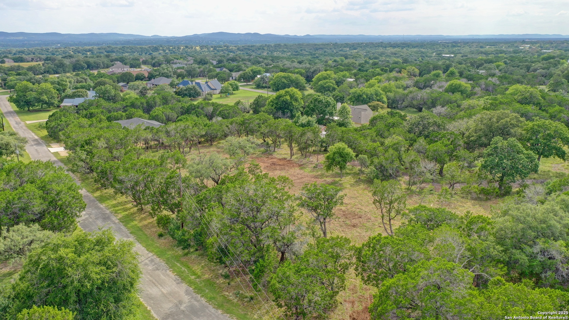 Lot 4 Heinen Bandera, TX 78003 - Photo 11 of 23 a view of a forest with a street