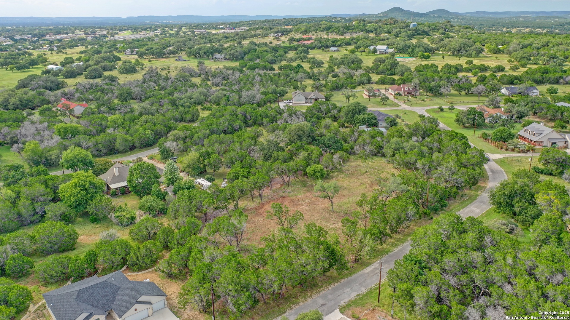 Lot 4 Heinen Bandera, TX 78003 - Photo 12 of 23 an aerial view of residential houses with outdoor space and trees