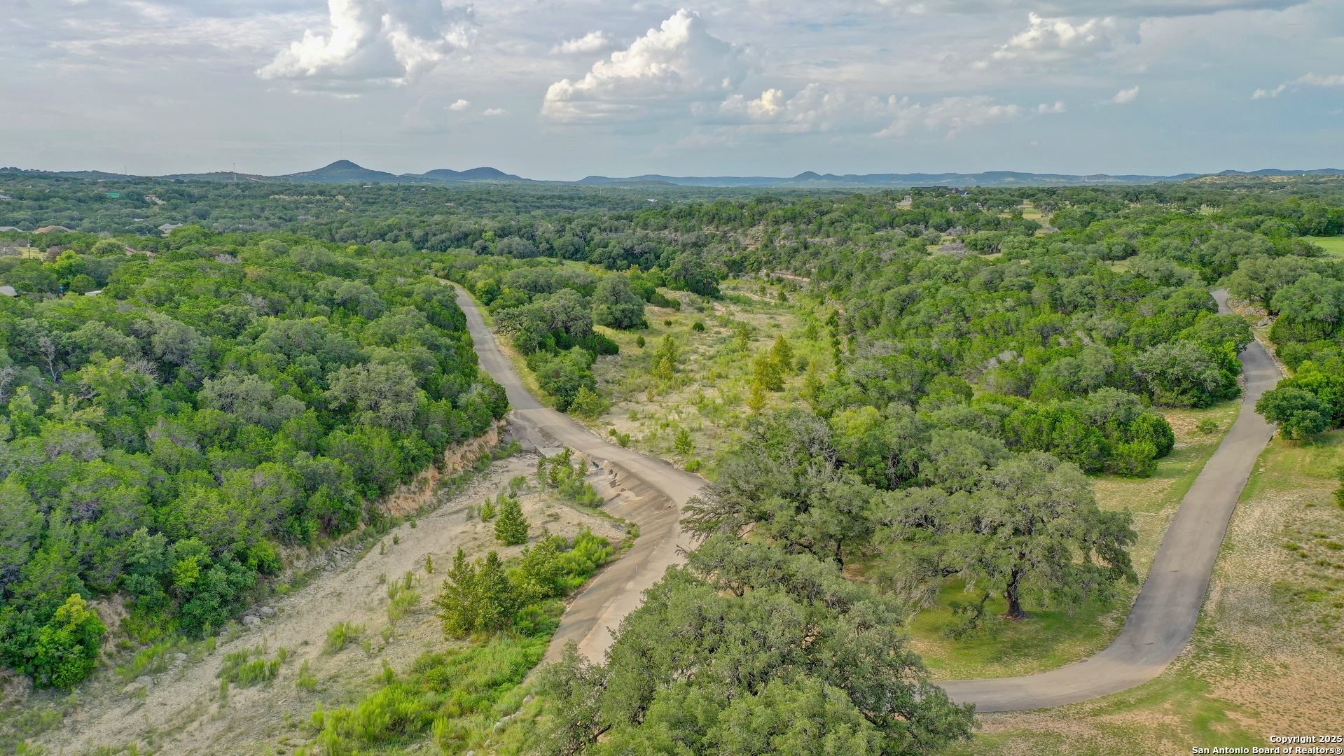 Lot 4 Heinen Bandera, TX 78003 - Photo 13 of 23 a view of a city with lush green forest