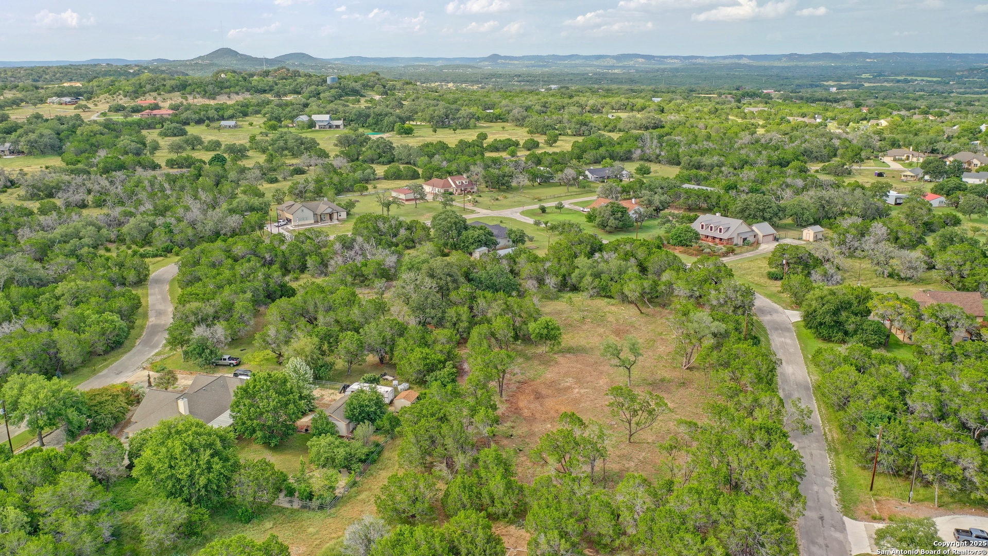 Lot 4 Heinen Bandera, TX 78003 - Photo 16 of 23 a view of a city with lush green forest