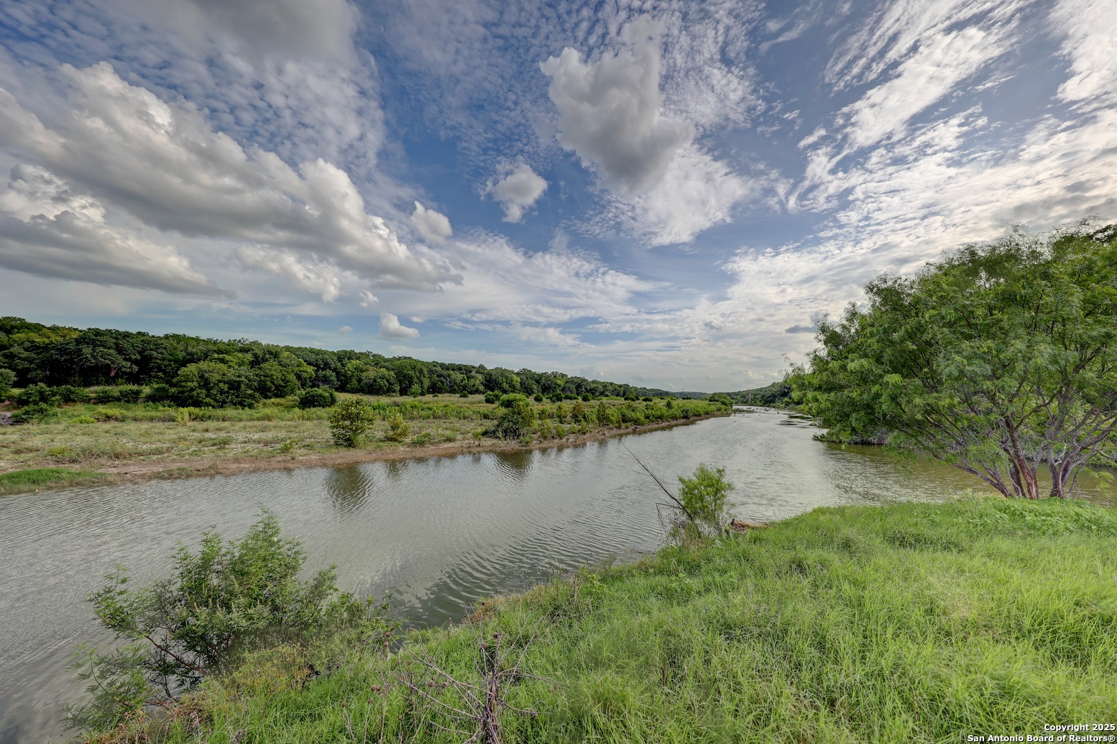 Lot 4 Heinen Bandera, TX 78003 - Photo 7 of 23 a view of a lake with houses in the back