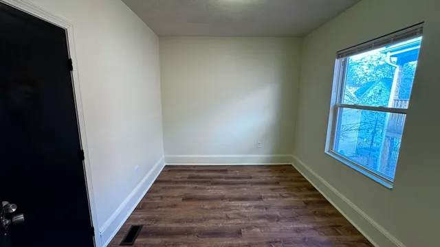 a view of an empty room and window