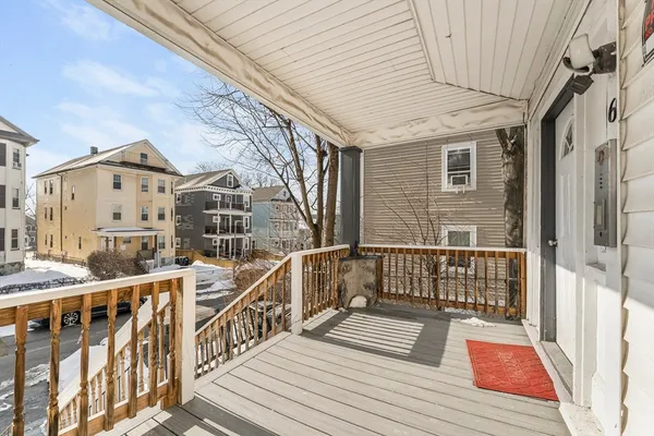 a view of a balcony with wooden floor