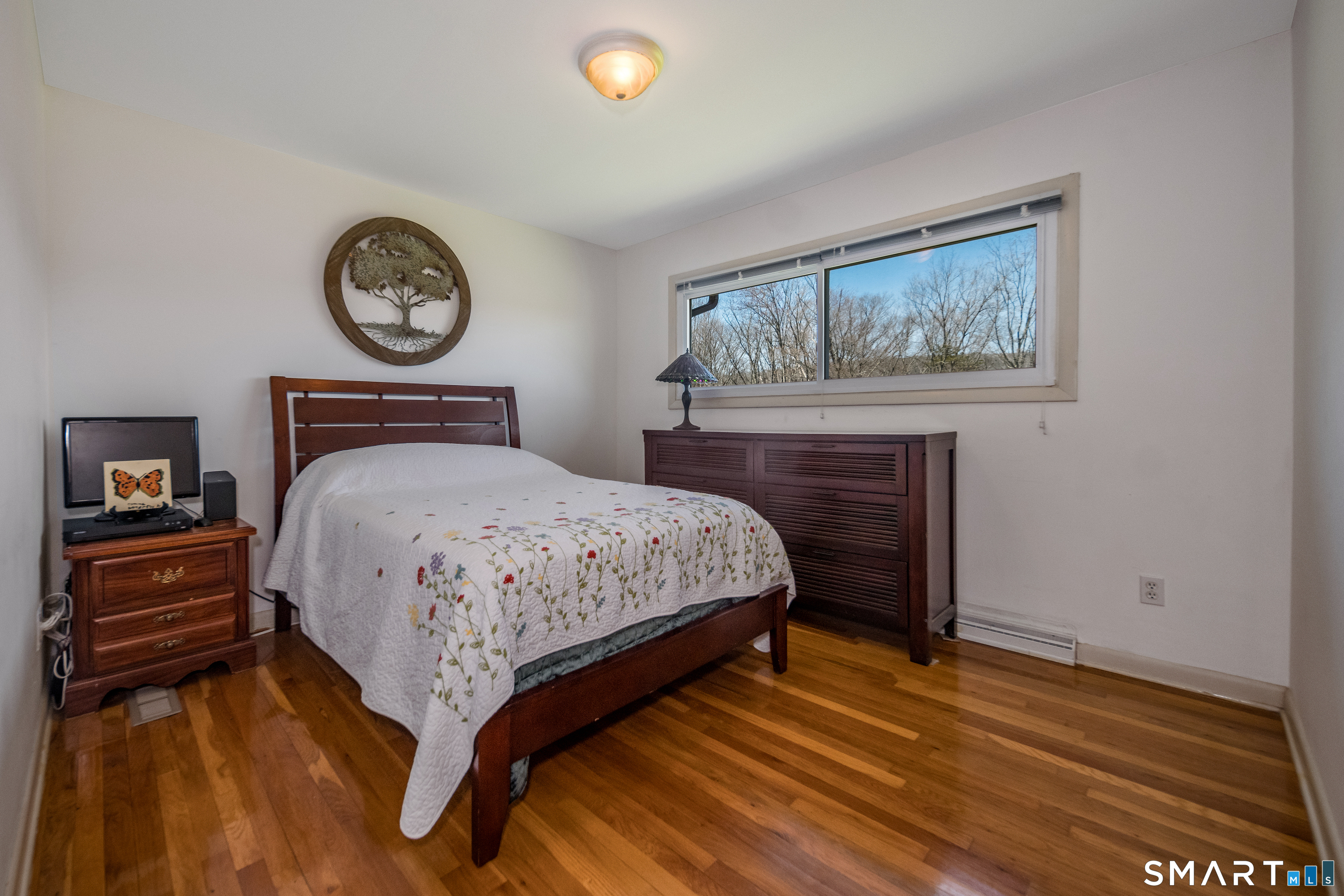 408 R Stage Coach Road Durham, CT 06422 - Photo 17 of 40 a bedroom with a bed and a lamp on table
