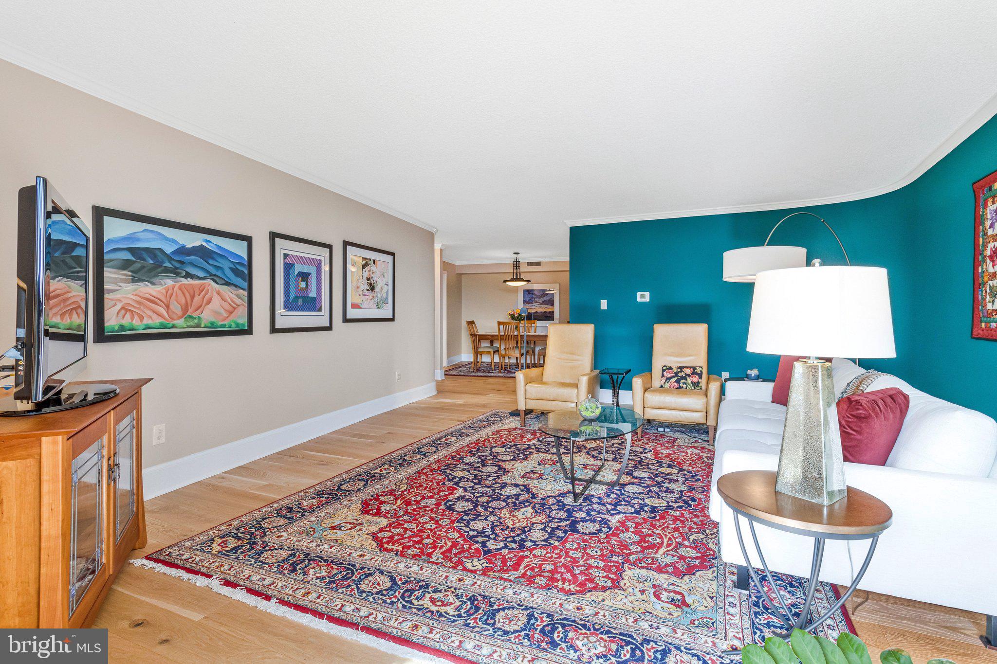 1101 South Arlington Ridge Road, Unit 706 Arlington, VA 22202 - Photo 14 of 59 a living room with furniture and a flat screen tv