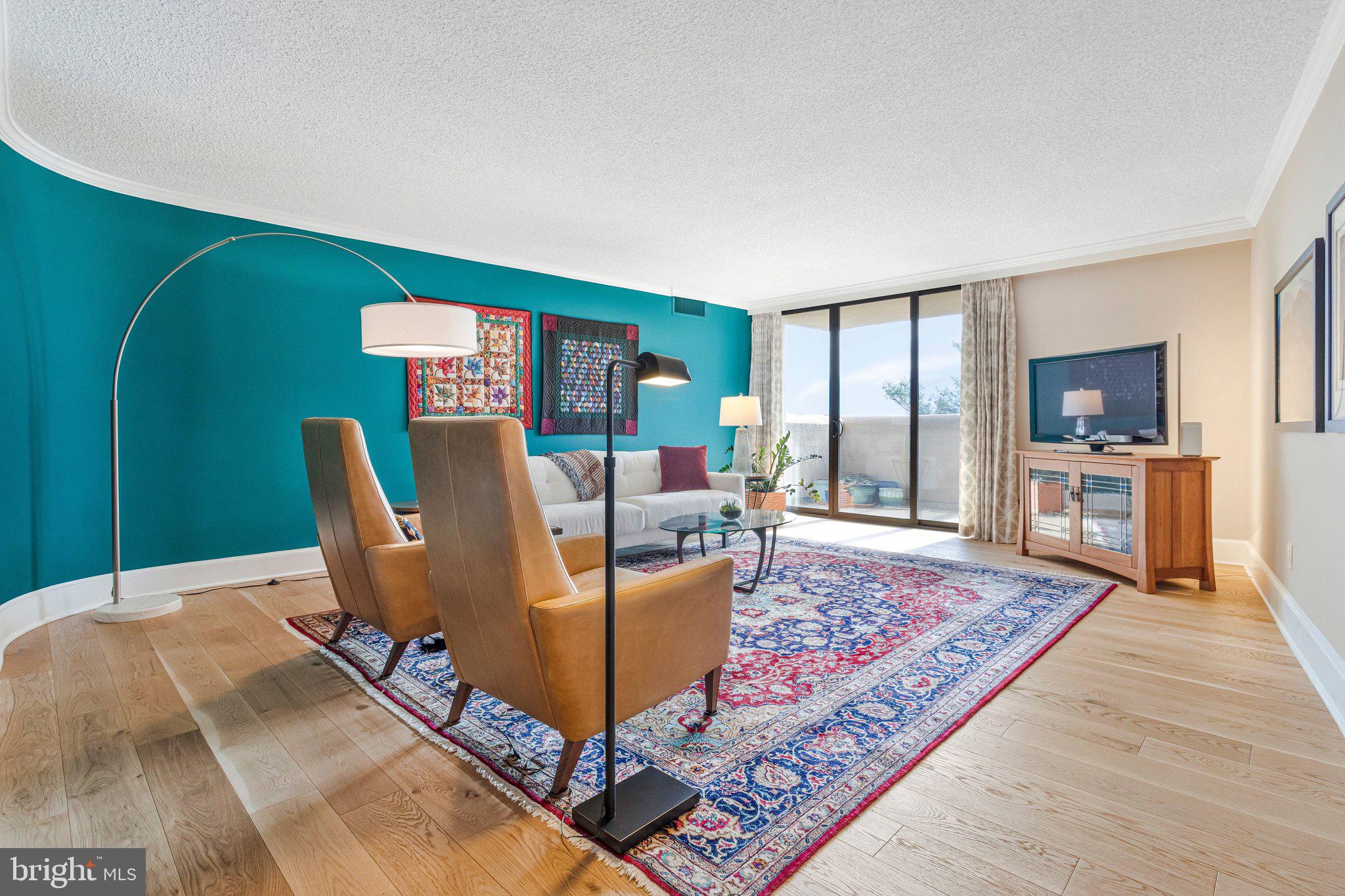1101 South Arlington Ridge Road, Unit 706 Arlington, VA 22202 - Photo 16 of 59 a living room with furniture rug and a fireplace