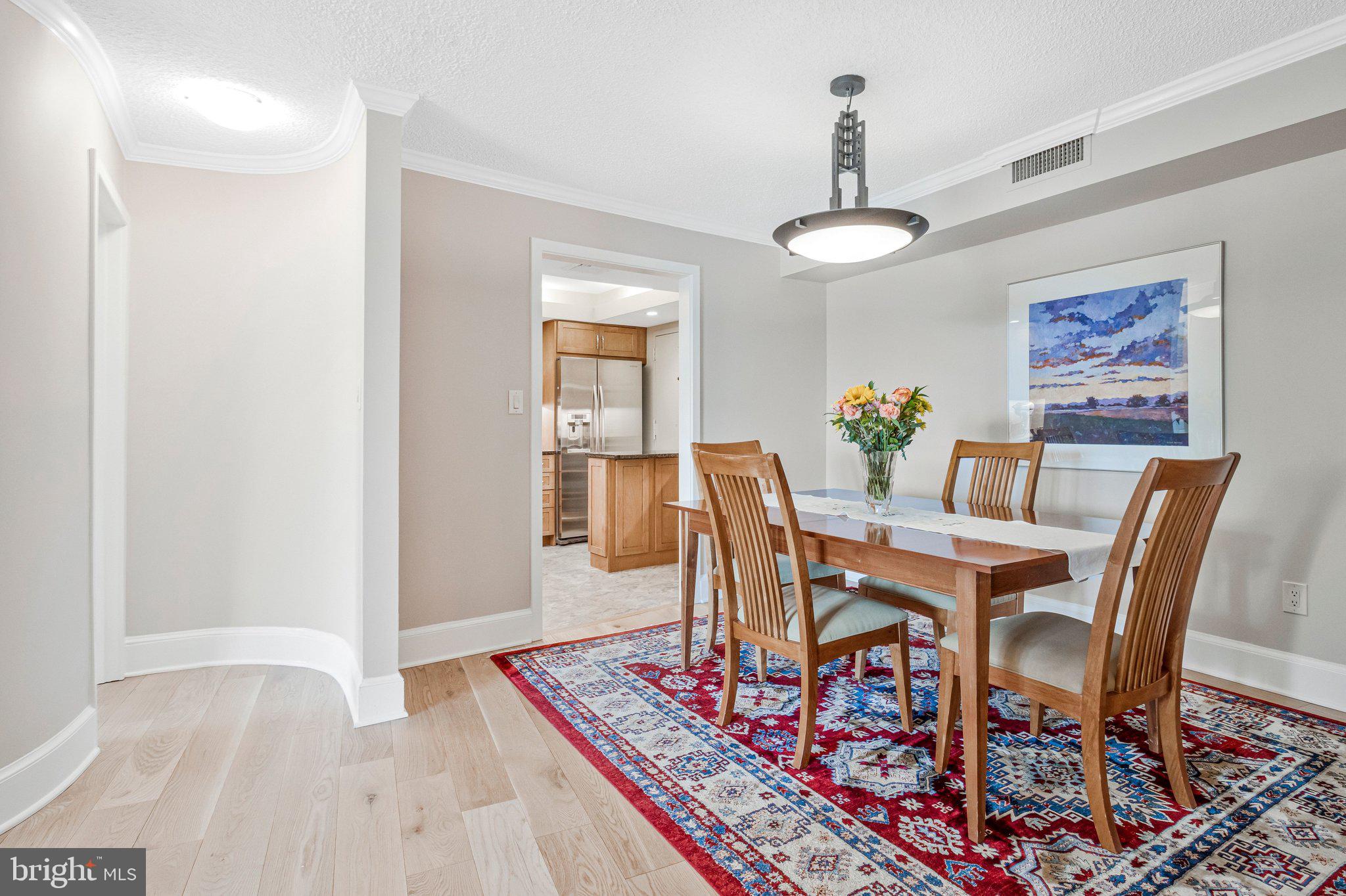 1101 South Arlington Ridge Road, Unit 706 Arlington, VA 22202 - Photo 17 of 59 a view of a dining room with furniture
