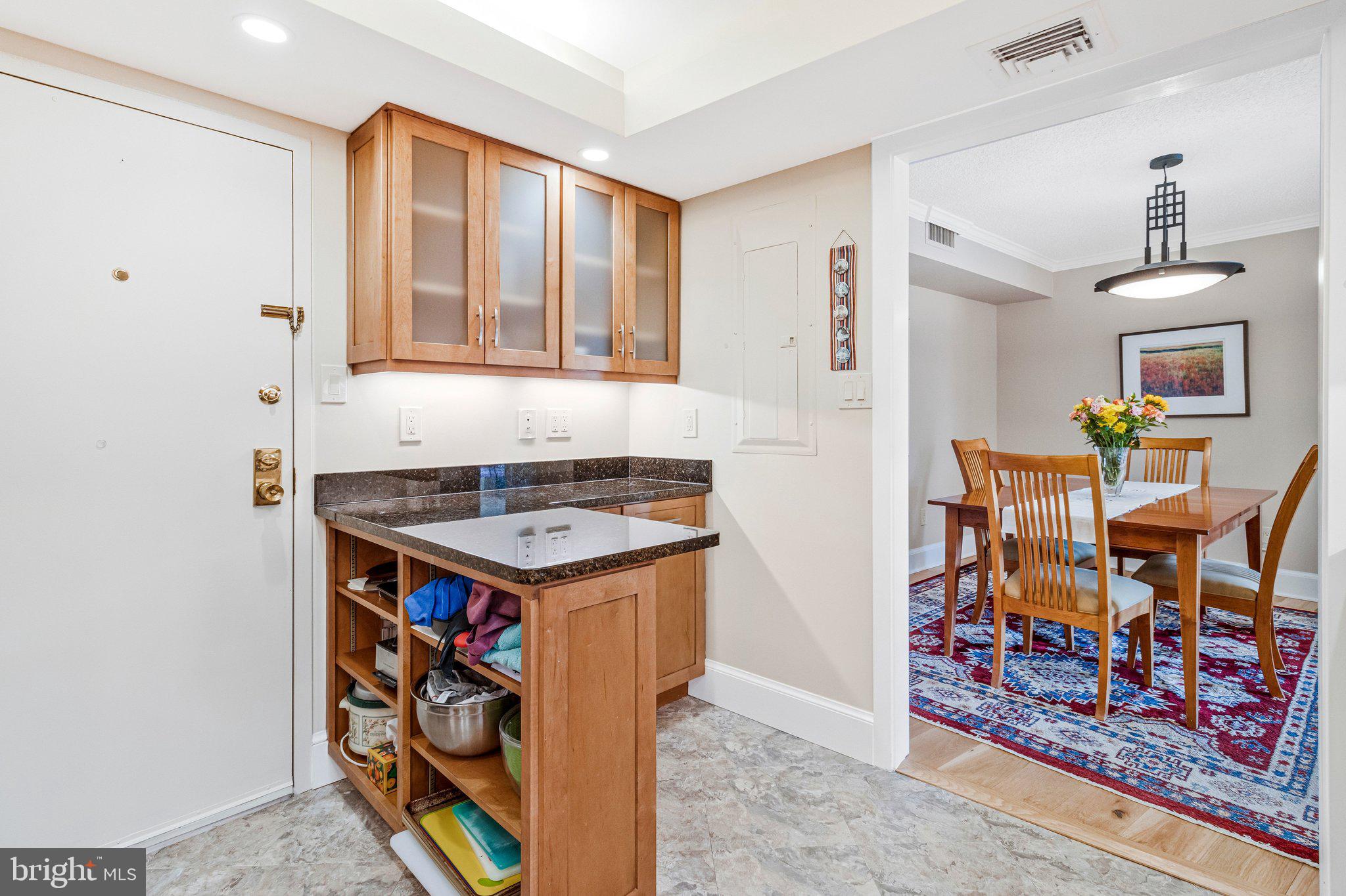 1101 South Arlington Ridge Road, Unit 706 Arlington, VA 22202 - Photo 24 of 59 a kitchen with stainless steel appliances granite countertop a stove and a cabinets