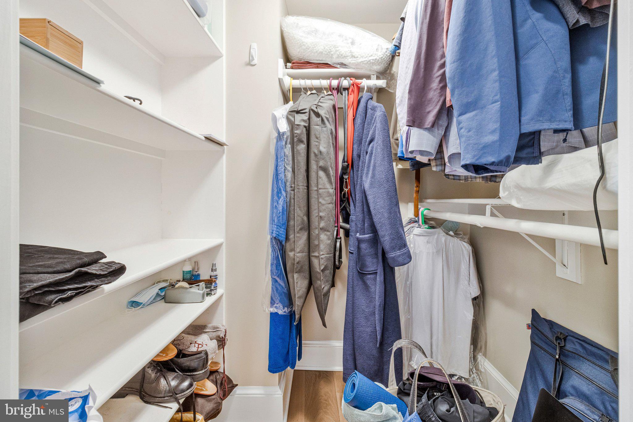 1101 South Arlington Ridge Road, Unit 706 Arlington, VA 22202 - Photo 31 of 59 a view of walk in closet with clothes and shoes