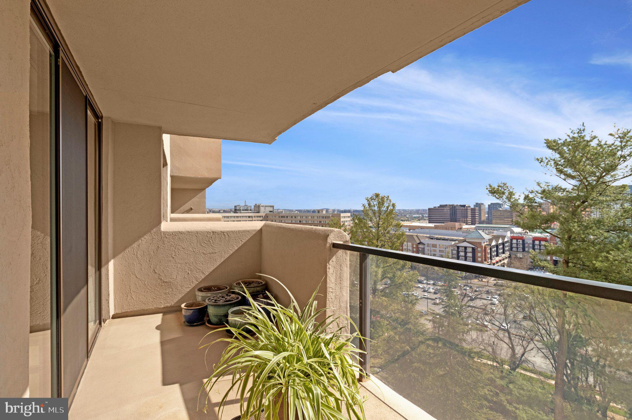 1101 South Arlington Ridge Road, Unit 706 Arlington, VA 22202 - Photo 46 of 59 a view of a balcony with an outdoor space and seating area