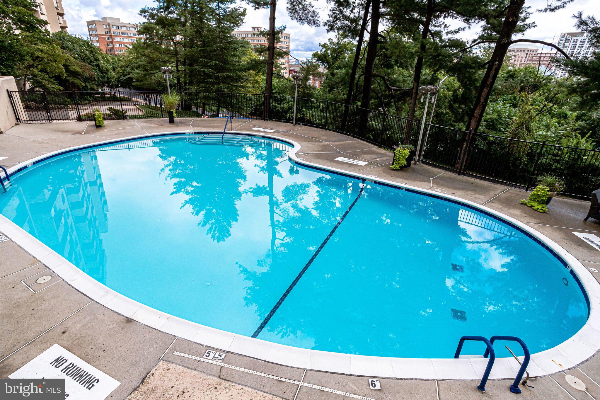 1101 South Arlington Ridge Road, Unit 706 Arlington, VA 22202 - Photo 49 of 59 a view of a swimming pool with a patio