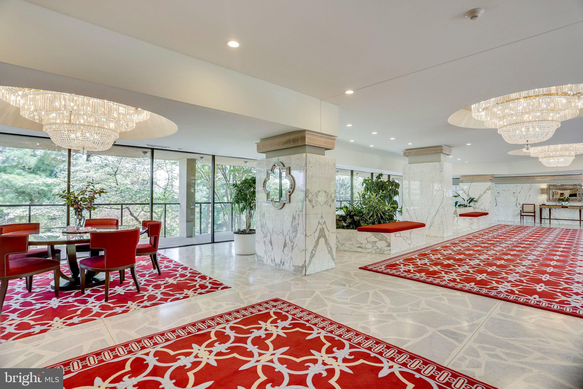 1101 South Arlington Ridge Road, Unit 706 Arlington, VA 22202 - Photo 5 of 59 a living room with furniture a rug and a floor to ceiling window