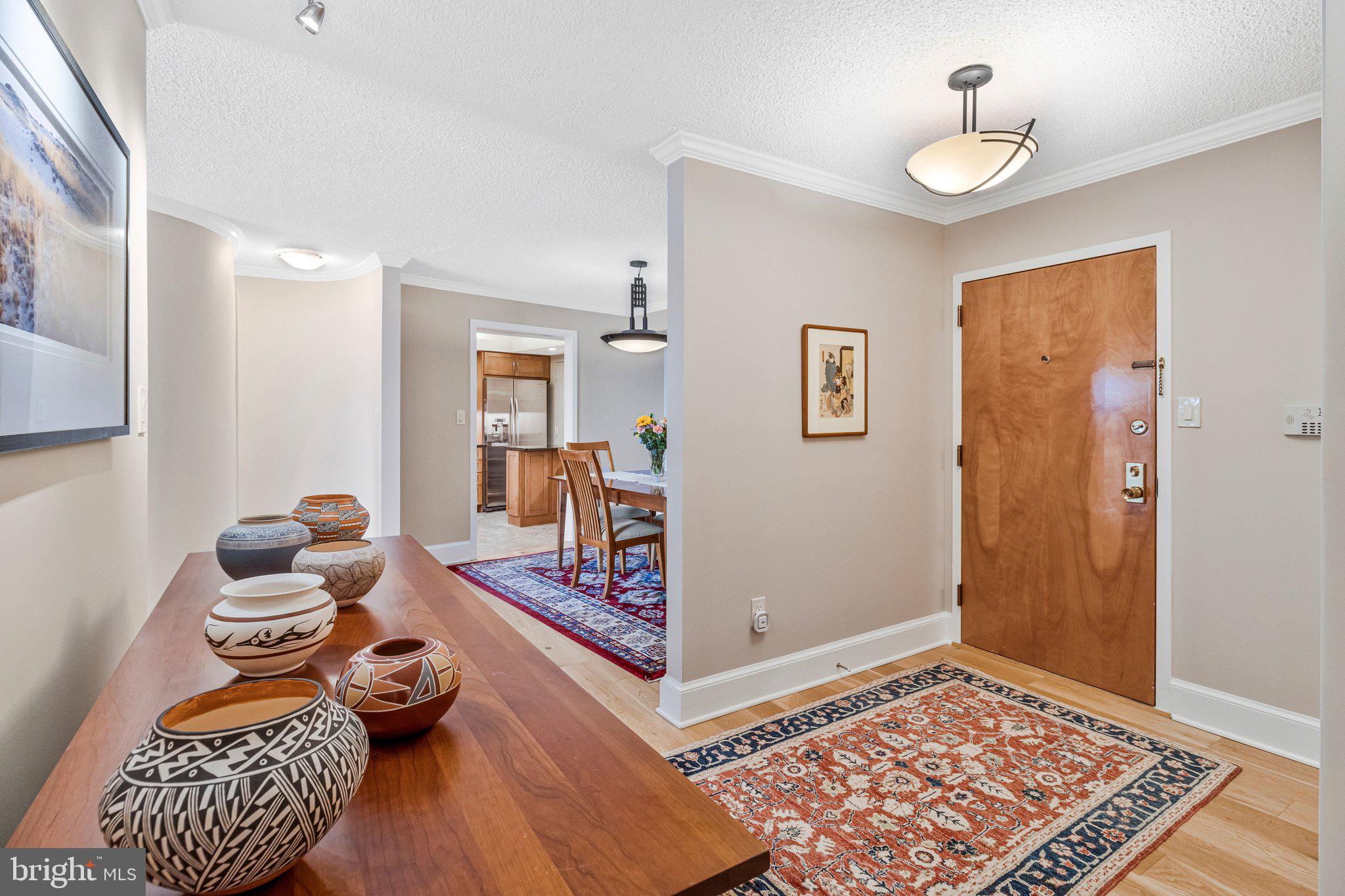 1101 South Arlington Ridge Road, Unit 706 Arlington, VA 22202 - Photo 7 of 59 a living room with furniture and a rug