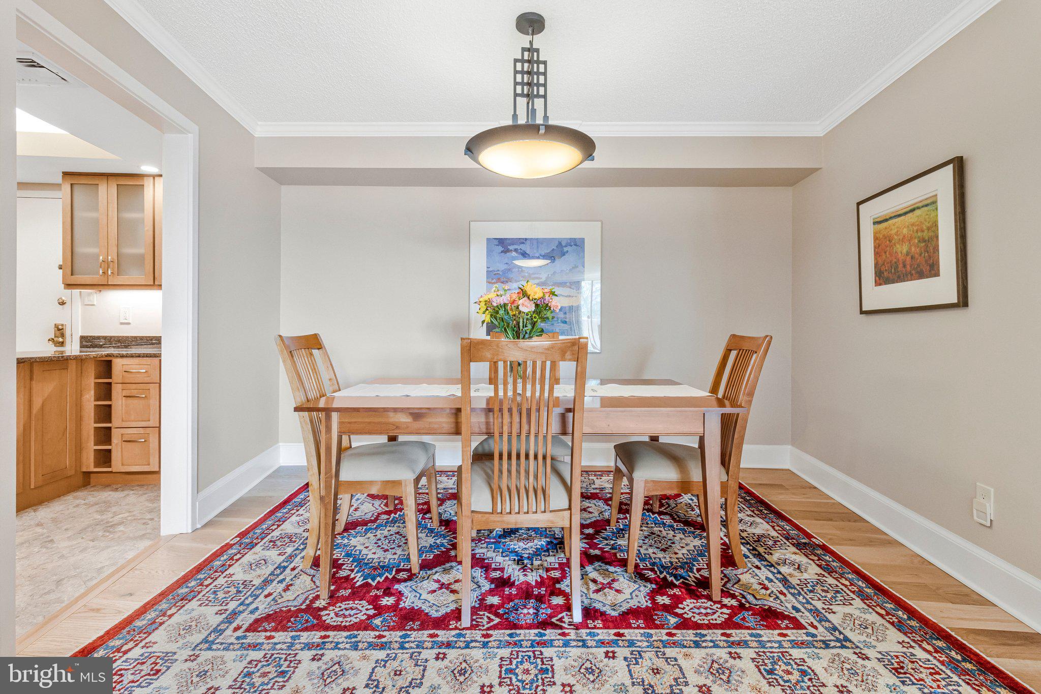 1101 South Arlington Ridge Road, Unit 706 Arlington, VA 22202 - Photo 8 of 59 a view of a dining room with furniture wooden floor and chandelier