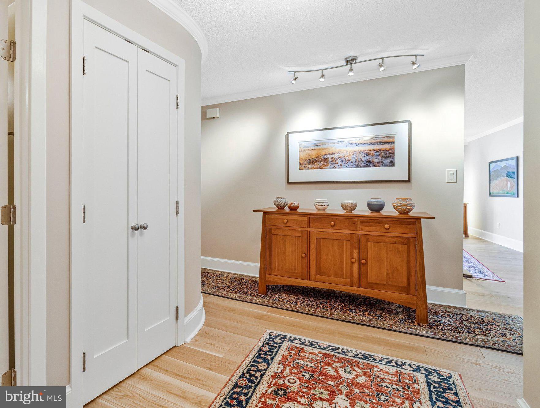 1101 South Arlington Ridge Road, Unit 706 Arlington, VA 22202 - Photo 9 of 59 a view of a hallway with wooden floor