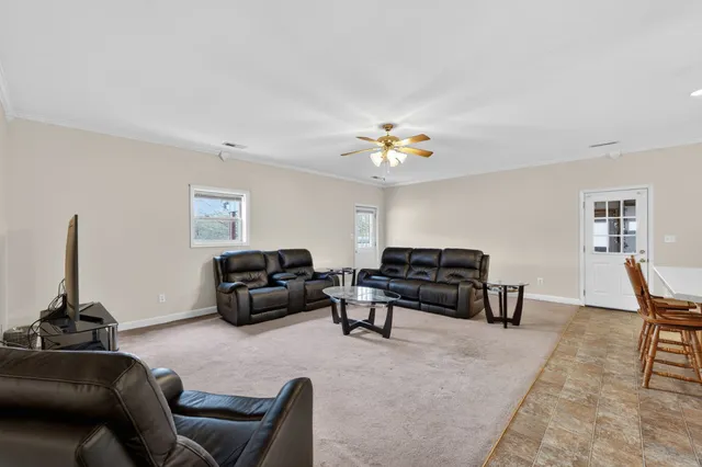 a living room with furniture and a table