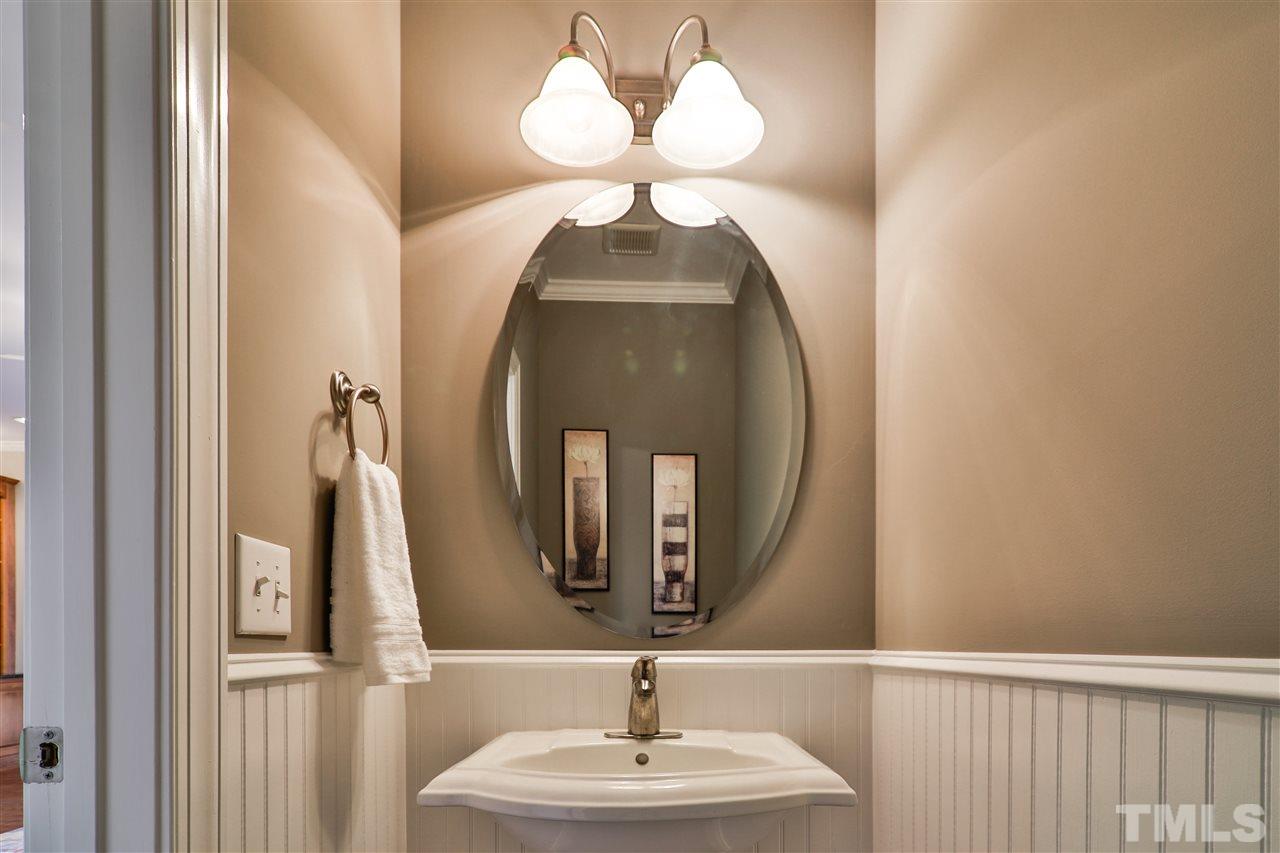 5741 Spring Glen Lane Raleigh, NC 27616 - Photo 13 of 25 a bathroom with a sink and a mirror
