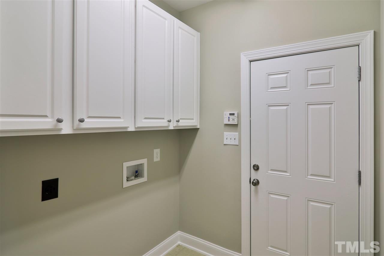 5741 Spring Glen Lane Raleigh, NC 27616 - Photo 14 of 25 a view of cabinets and entryway