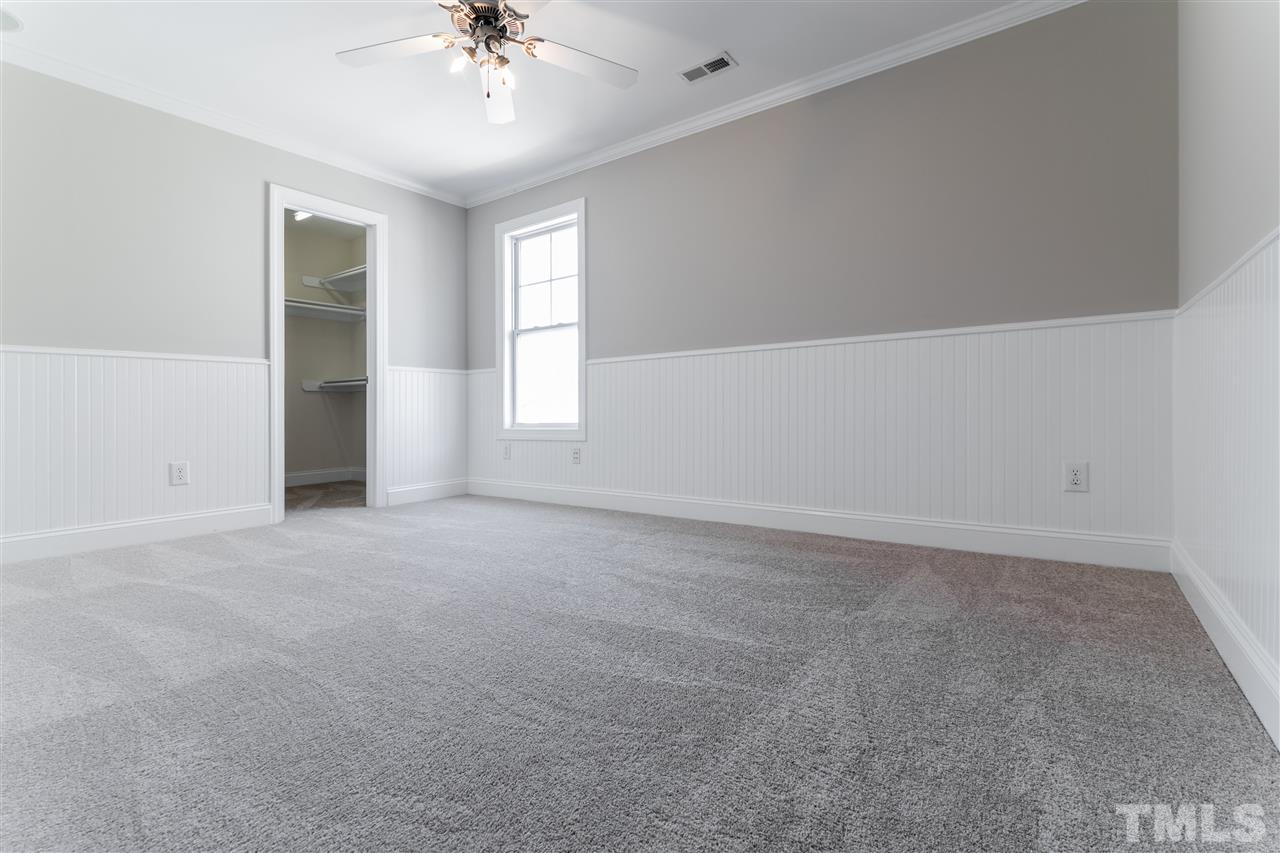5741 Spring Glen Lane Raleigh, NC 27616 - Photo 15 of 25 a view of an empty room with a window
