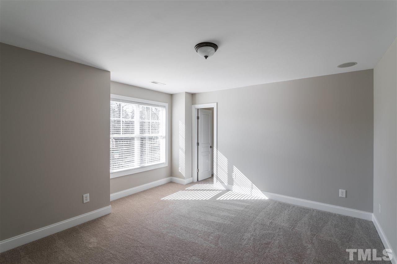 5741 Spring Glen Lane Raleigh, NC 27616 - Photo 16 of 25 an empty room with a window