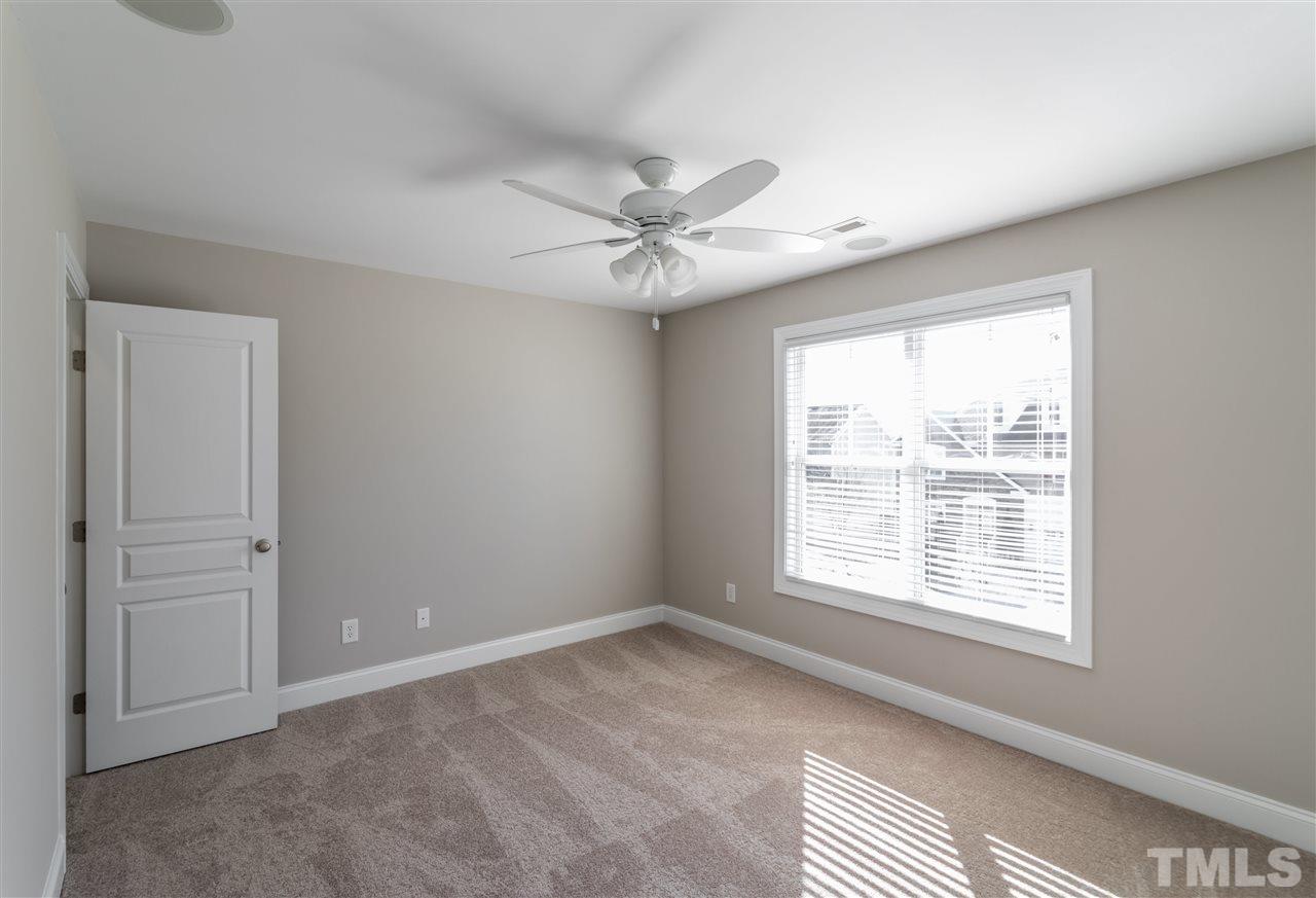 5741 Spring Glen Lane Raleigh, NC 27616 - Photo 17 of 25 a view of an empty room with a window