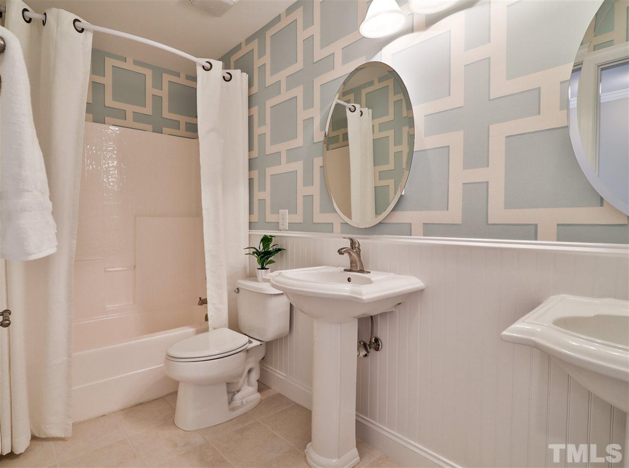 5741 Spring Glen Lane Raleigh, NC 27616 - Photo 18 of 25 a bathroom with a sink toilet and shower