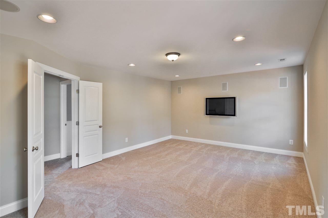 5741 Spring Glen Lane Raleigh, NC 27616 - Photo 20 of 25 a view of an empty room with a tv