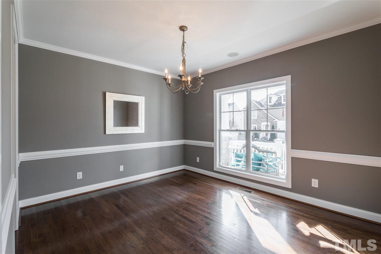 5741 Spring Glen Lane Raleigh, NC 27616 - Photo 4 of 25 a view of a livingroom with wooden floor and a window