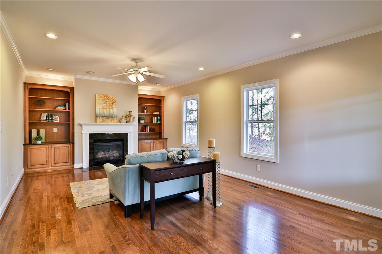 5741 Spring Glen Lane Raleigh, NC 27616 - Photo 9 of 25 a living room with furniture and a fireplace