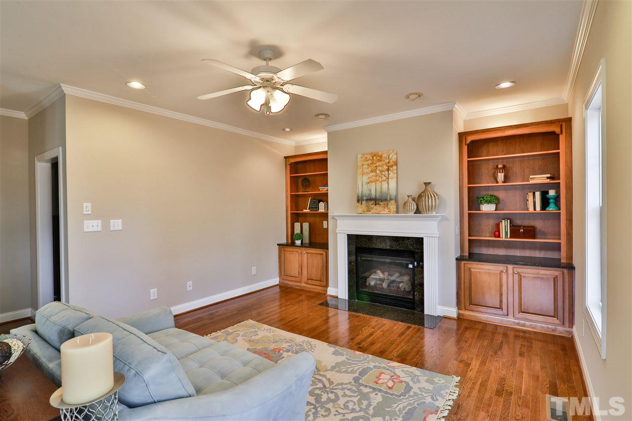 5741 Spring Glen Lane Raleigh, NC 27616 - Photo 10 of 25 a living room with furniture and a fireplace