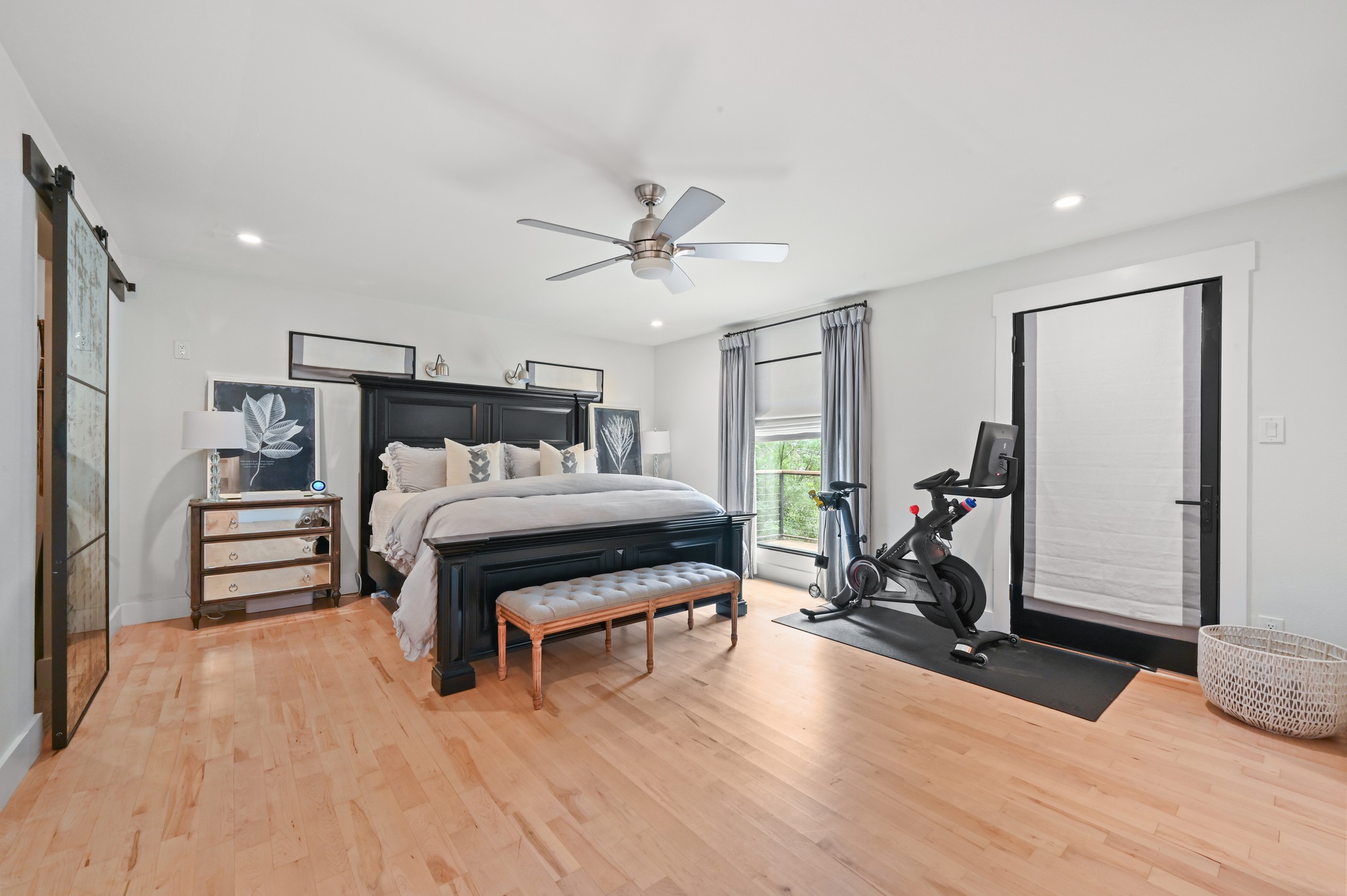3 Timberline Ridge Austin, TX 78746 - Photo 11 of 21 Expansive primary bedroom located on the main floor with direct access to balcony.