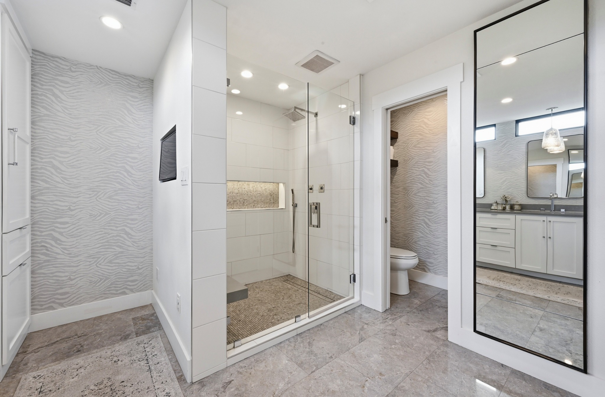 3 Timberline Ridge Austin, TX 78746 - Photo 13 of 21 Glass-enclosed shower with a tiled bench and recessed niche