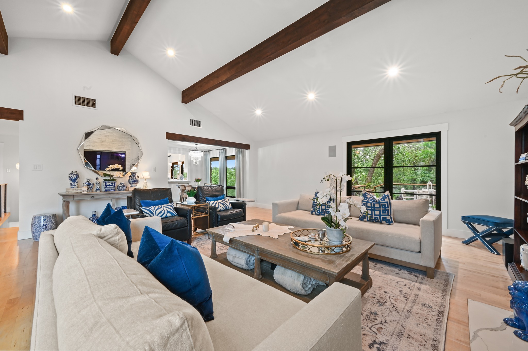 3 Timberline Ridge Austin, TX 78746 - Photo 2 of 21 Open living area filled with abundant natural light, soaring ceilings, and an airy, spacious feel. Designed for comfortable everyday living and effortless entertaining.