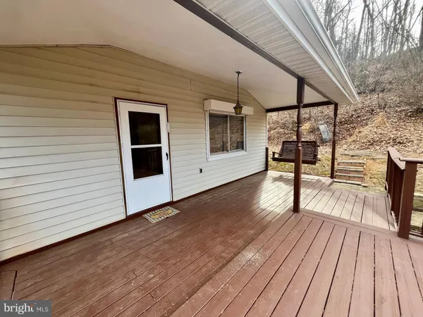 a view of a patio with wooden floor