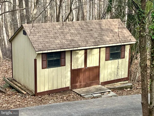 a view of a house with large windows